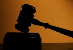 A judge's gavel in shadow